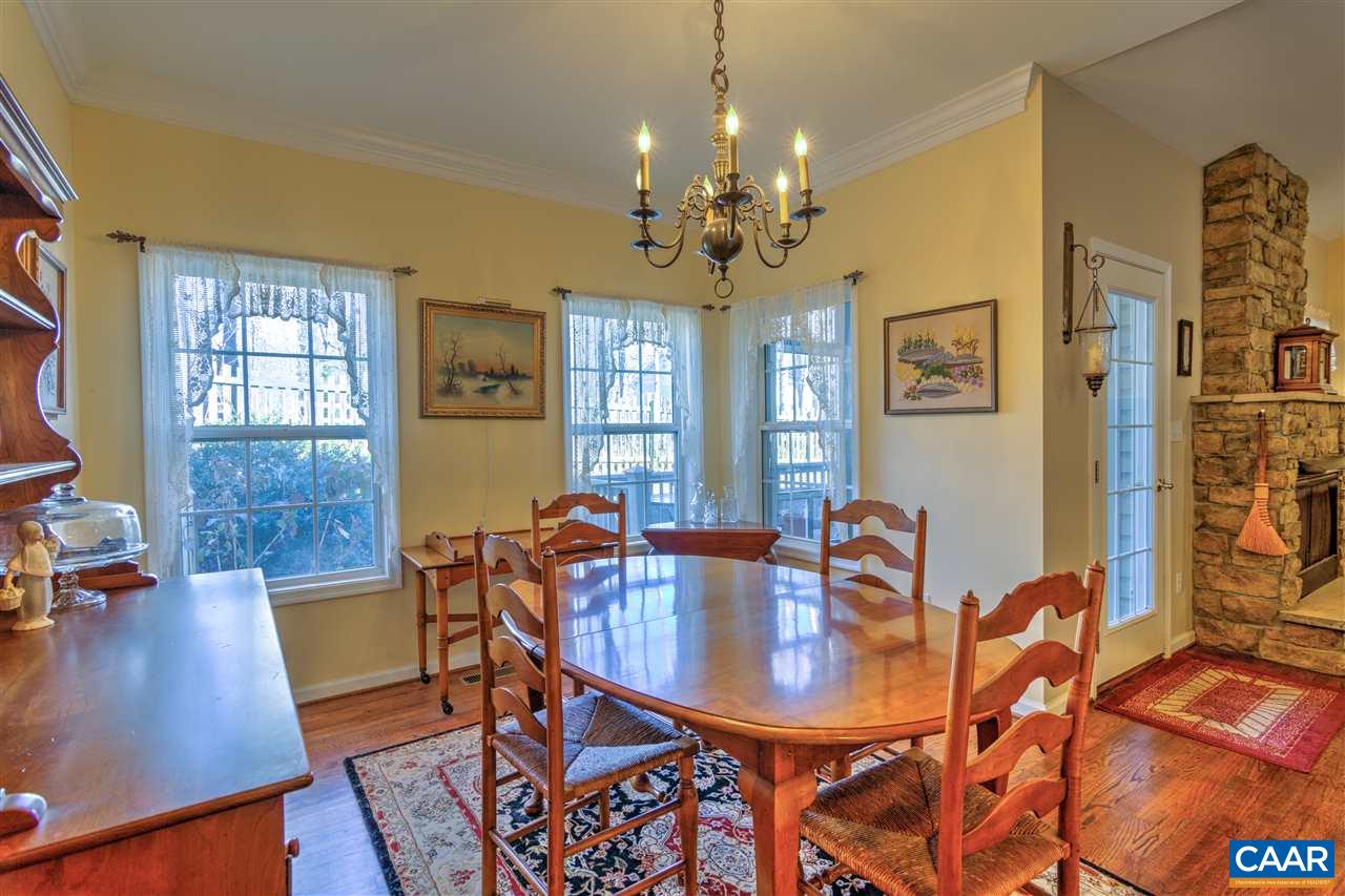 32 Zephyr Road Palmyra, VA 22963 - Photo 16 of 31 a view of a dining room with furniture a chandelier and wooden floor