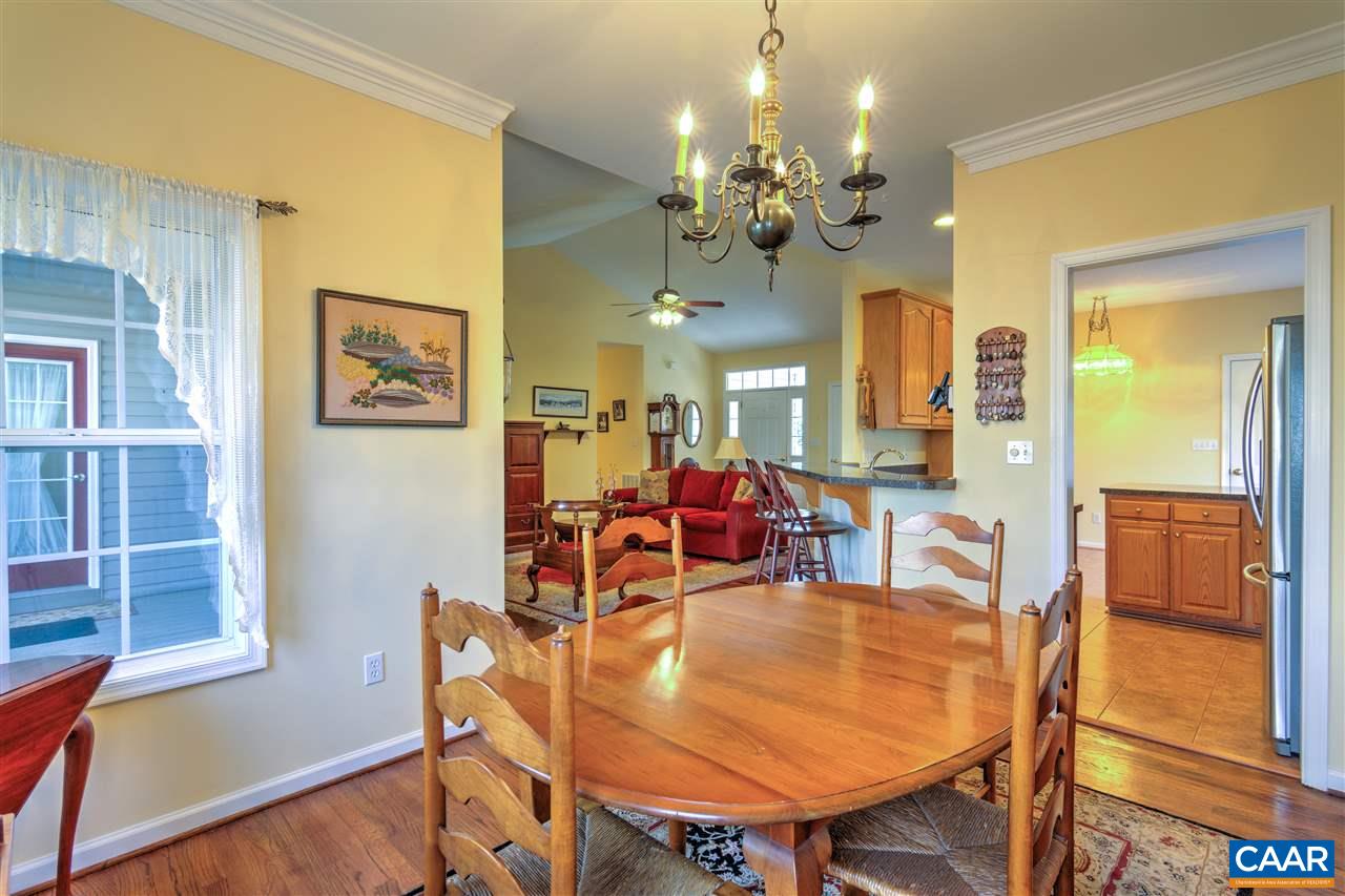 32 Zephyr Road Palmyra, VA 22963 - Photo 17 of 31 a view of a dining room with furniture and a chandelier