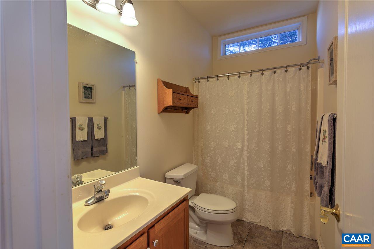 32 Zephyr Road Palmyra, VA 22963 - Photo 27 of 31 a bathroom with a sink and a mirror