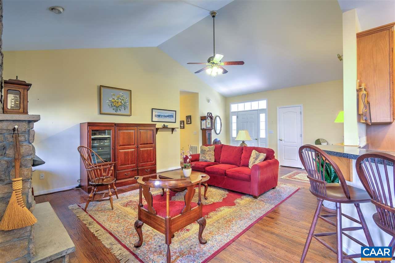 32 Zephyr Road Palmyra, VA 22963 - Photo 6 of 31 a living room with furniture a ceiling fan and a window