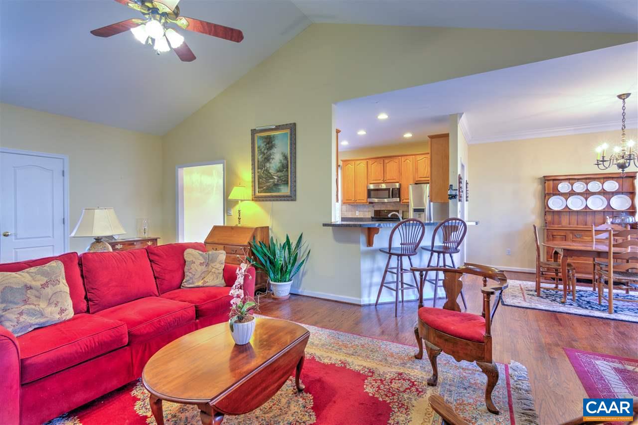 32 Zephyr Road Palmyra, VA 22963 - Photo 7 of 31 a living room with furniture and a chandelier