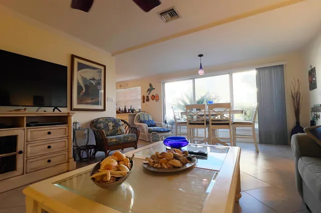 a bedroom with furniture and a flat screen tv