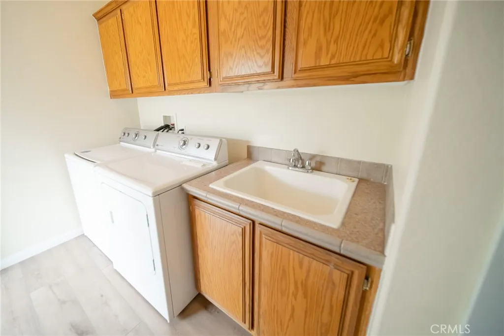49 Pine Via Anaheim, CA 92802 - Photo 13 of 23 a utility room with dryer and washer