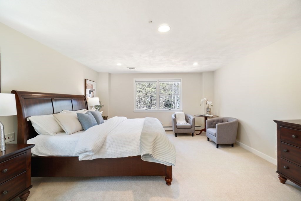 89 Plain Road Wayland, MA 01778 - Photo 19 of 30 a bedroom with a bed and a couch