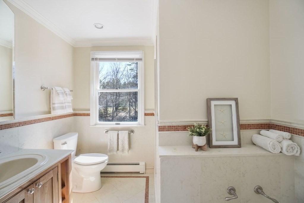 89 Plain Road Wayland, MA 01778 - Photo 21 of 30 a bathroom with a toilet sink and window