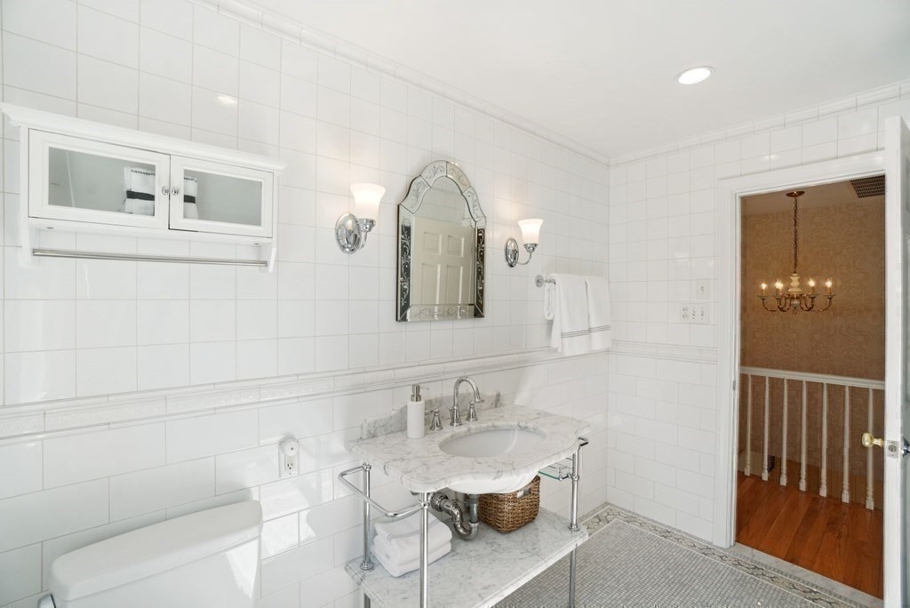 89 Plain Road Wayland, MA 01778 - Photo 23 of 30 a bathroom with a sink and a mirror