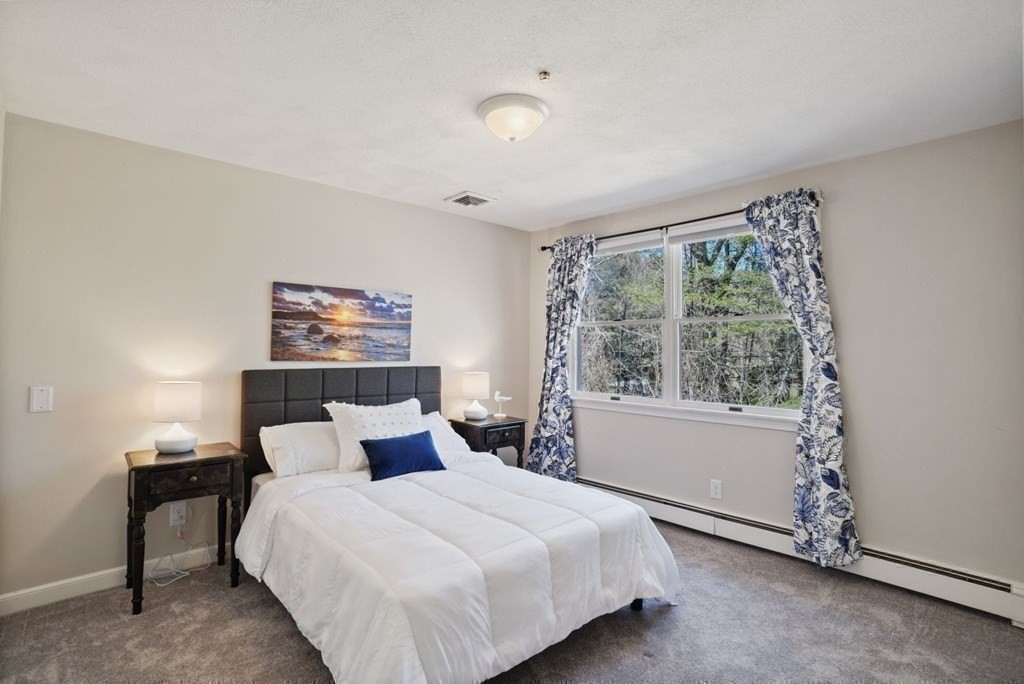 89 Plain Road Wayland, MA 01778 - Photo 25 of 30 a bedroom with a bed and a window