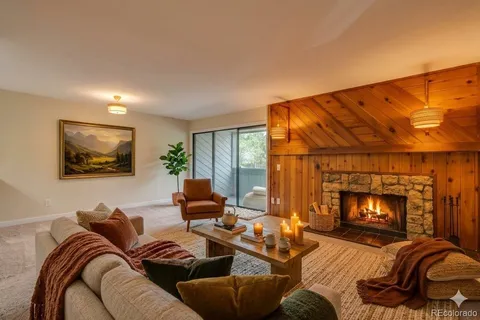 a view of empty room with a fireplace