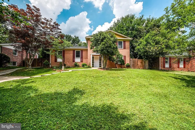 a house view with a sitting space and garden
