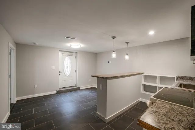 a view of kitchen with furniture and window