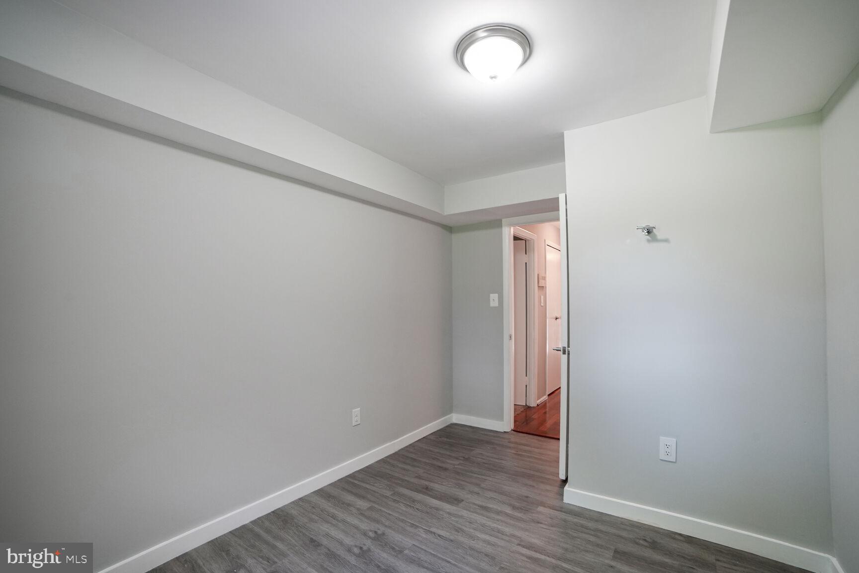 716 Downs Drive Silver Spring, MD 20904 - Photo 14 of 33 a view of an empty room with wooden floor