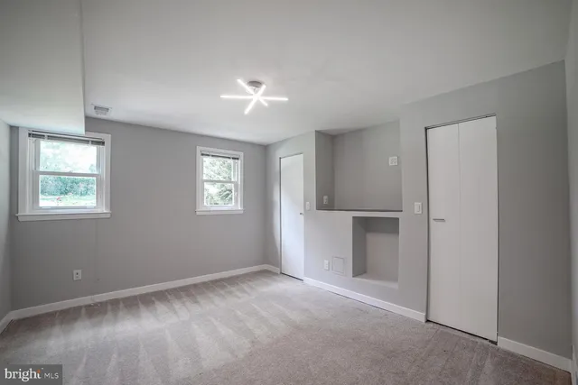 a view of an empty room with a window