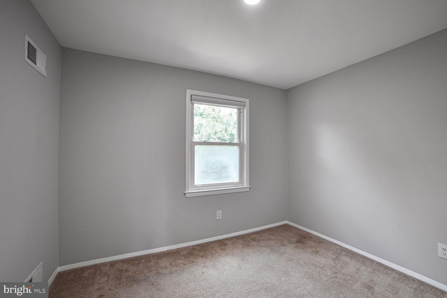 716 Downs Drive Silver Spring, MD 20904 - Photo 21 of 33 an empty room with windows