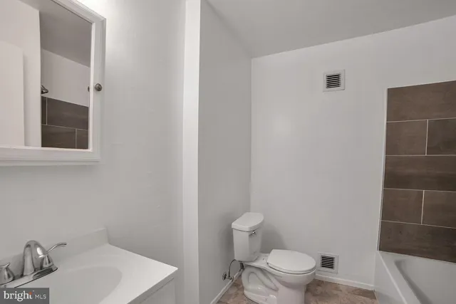 a bathroom with a sink and a toilet