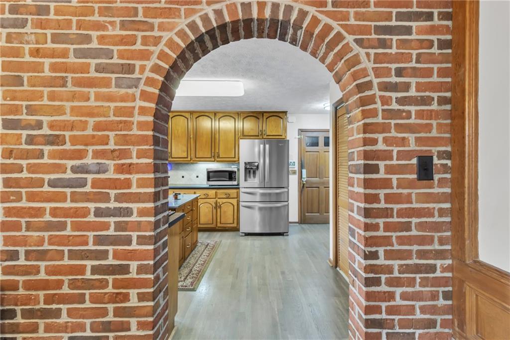 838 Conyers Road McDonough, GA 30252 - Photo 12 of 31 a bathroom with a granite countertop sink a toilet a mirror and shower
