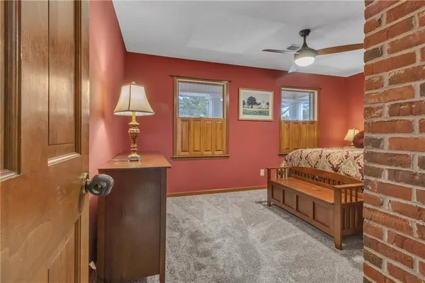 a bedroom with bed and a window