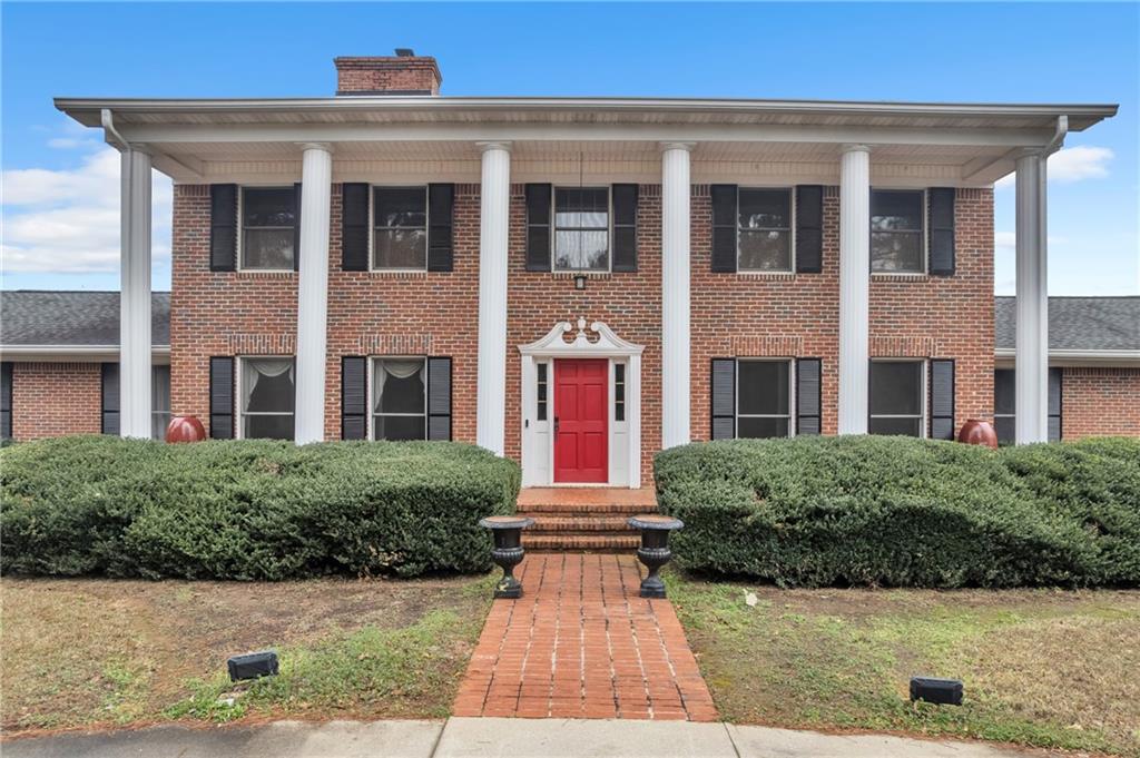 838 Conyers Road McDonough, GA 30252 - Photo 2 of 31 a view of building with brick walls