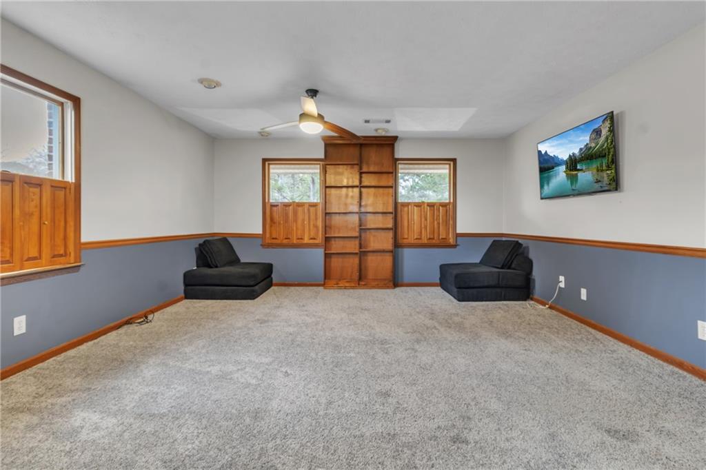 838 Conyers Road McDonough, GA 30252 - Photo 21 of 31 an empty room with windows and cabinet