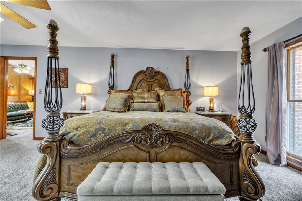 838 Conyers Road McDonough, GA 30252 - Photo 24 of 31 a bedroom with a bed and a mirror