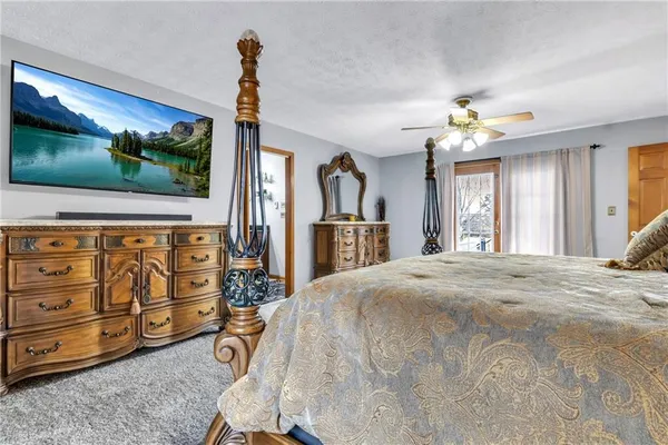 a view of a livingroom with furniture and natural light