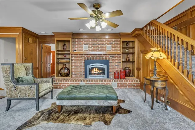 a kitchen with stainless steel appliances granite countertop a sink dishwasher stove and cabinets with wooden floor