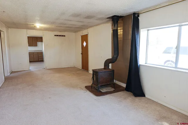 a view of a house with wooden fence
