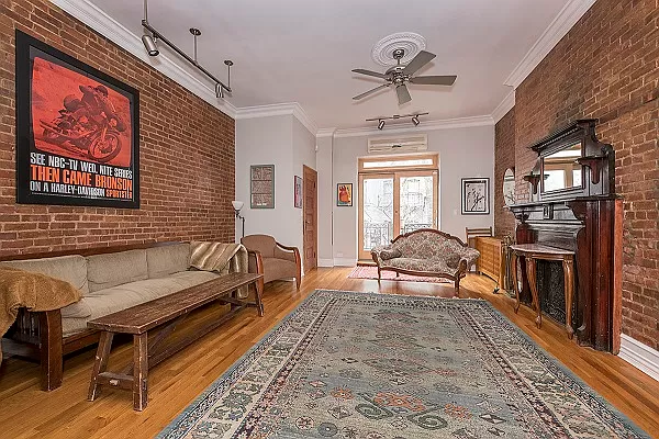 4 bedroom home with 2.5 bath, living space shown with brick fireplace and large front window
