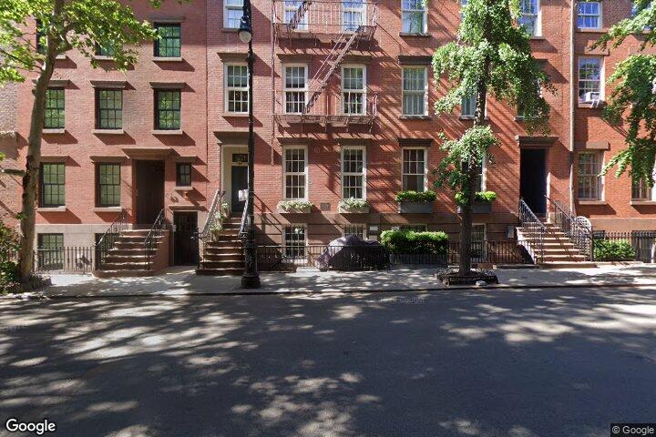Building facade of 81 Horatio St a brick townhouse in the West Village. 