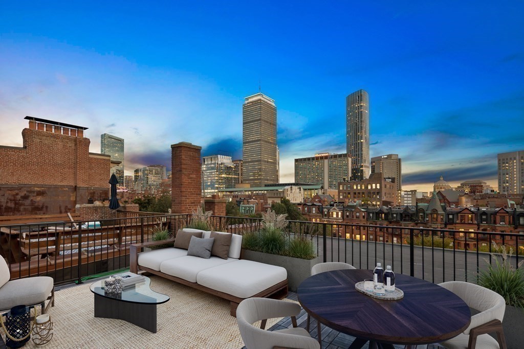 Rooftop patio with view of Boston skyline