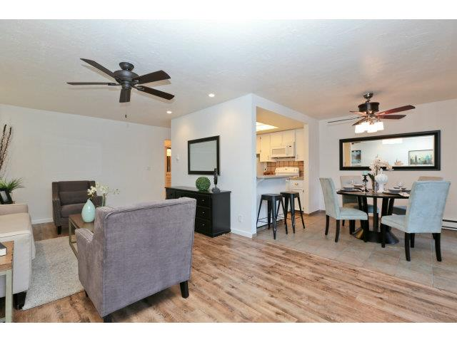 White kitchen with grey couch