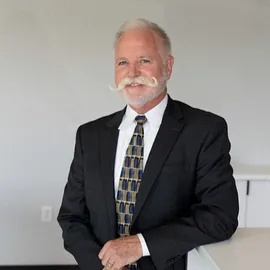 Dan McGrath, Agent in  - Compass
