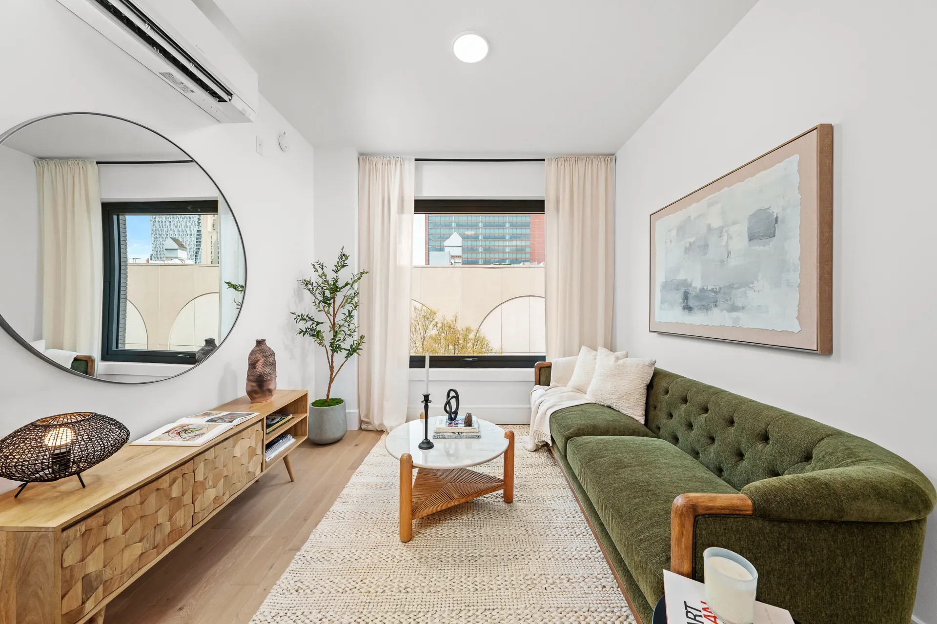 Green couch, coffee table, window