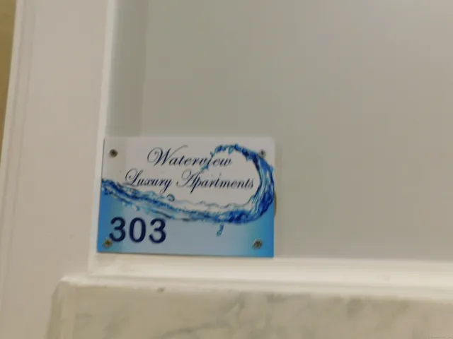 a white house with a black and white wall