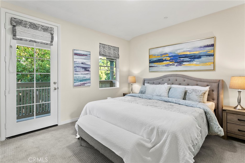 44 Modesto Irvine, CA 92602 - Photo 12 of 49 a spacious bedroom with a bed and a large window