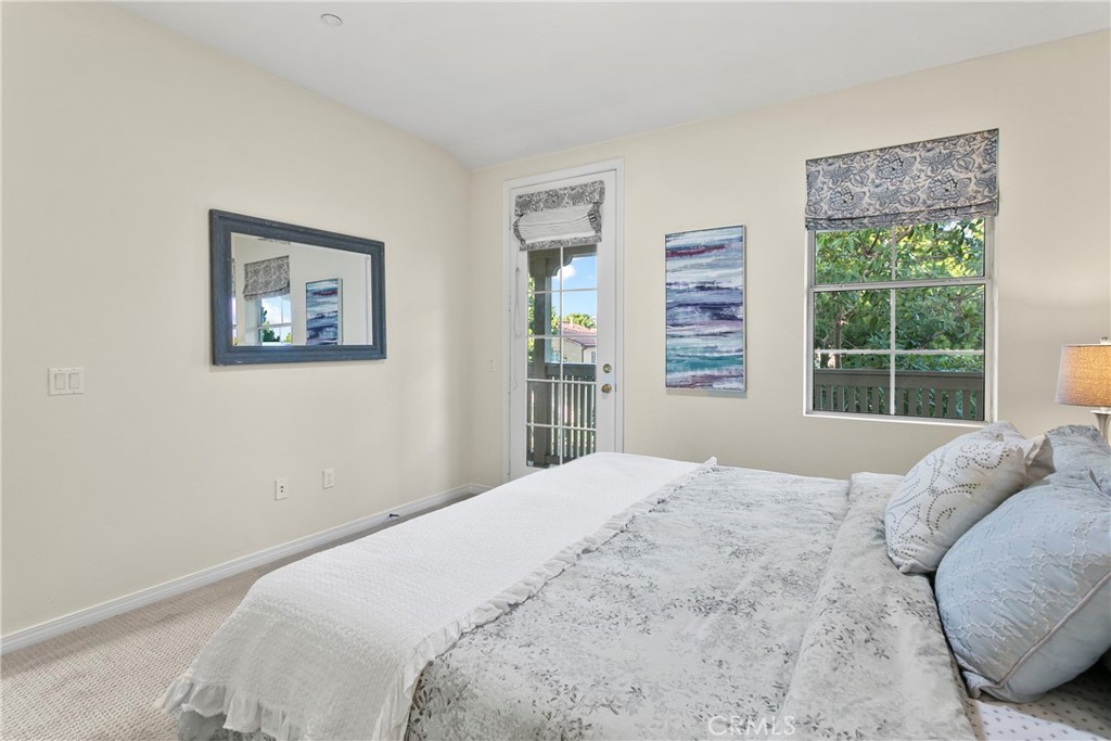 44 Modesto Irvine, CA 92602 - Photo 13 of 49 a bedroom with a large bed and a window