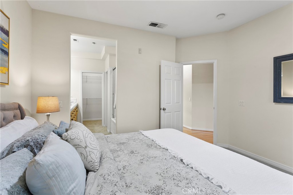 44 Modesto Irvine, CA 92602 - Photo 16 of 49 a bedroom with a bed and a lamp