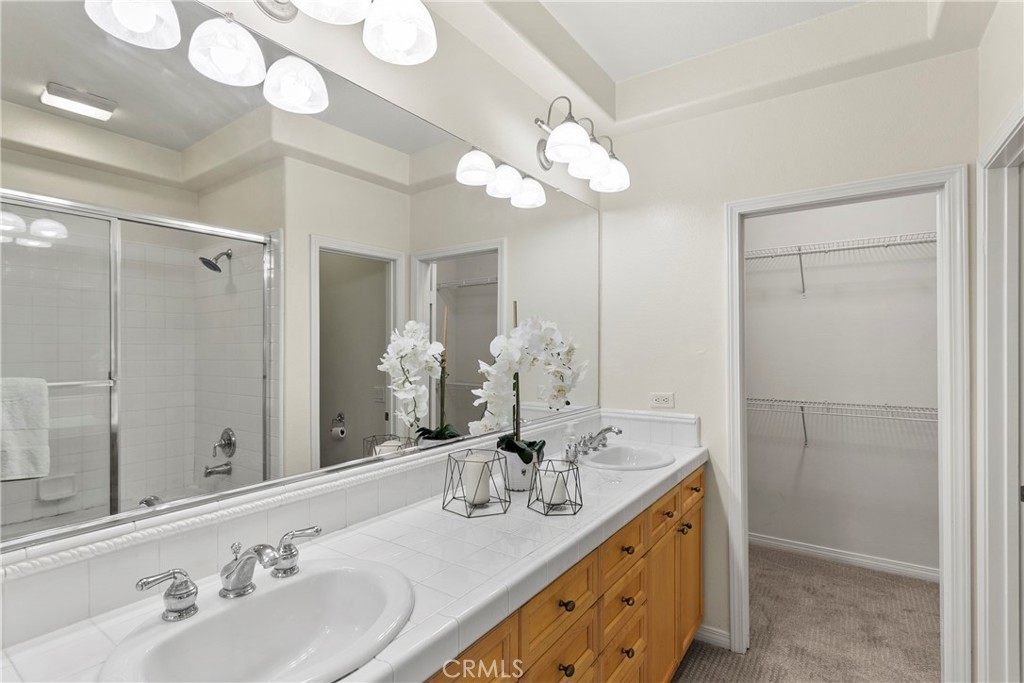 44 Modesto Irvine, CA 92602 - Photo 17 of 49 a bathroom with a double vanity sink mirror and double