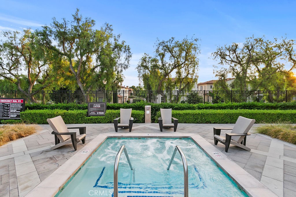 44 Modesto Irvine, CA 92602 - Photo 46 of 49 a view of a patio with a table chairs and a fire pit