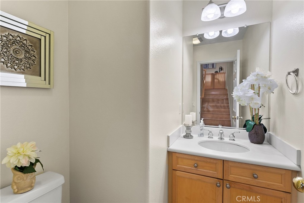 44 Modesto Irvine, CA 92602 - Photo 10 of 49 a bathroom with a sink vanity and a mirror