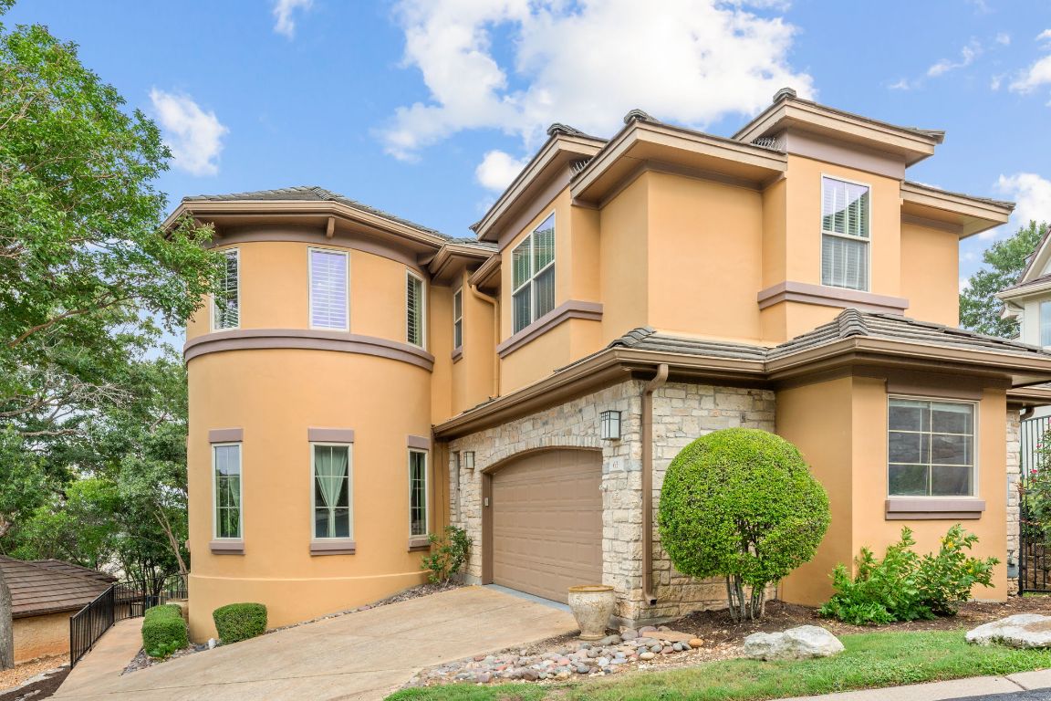 a front view of a house with garden