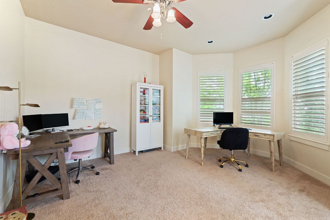 2800 Waymaker Way, Unit 63 Austin, TX 78746 - Photo 13 of 36 a view of a workspace with furniture and a window