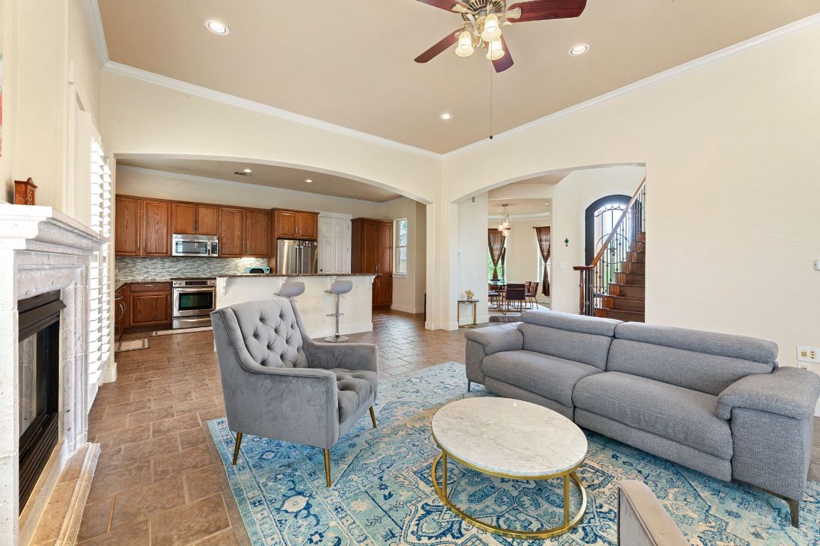 2800 Waymaker Way, Unit 63 Austin, TX 78746 - Photo 15 of 36 a living room with furniture and a fireplace
