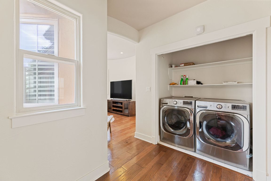2800 Waymaker Way, Unit 63 Austin, TX 78746 - Photo 18 of 36 a view of a livingroom with washing machine and dryer
