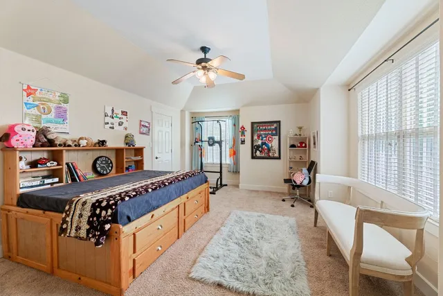 a view of a livingroom with washing machine and dryer