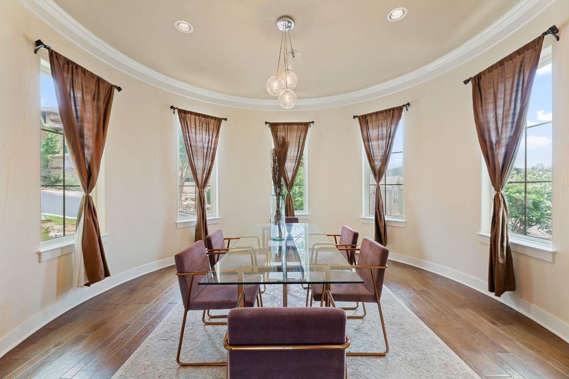 2800 Waymaker Way, Unit 63 Austin, TX 78746 - Photo 2 of 36 a view of a dining room with furniture window and wooden floor