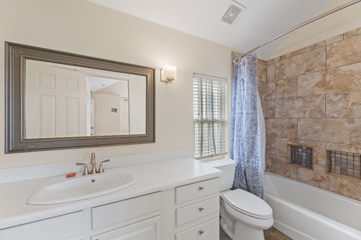 2800 Waymaker Way, Unit 63 Austin, TX 78746 - Photo 20 of 36 a bathroom with a sink toilet and shower