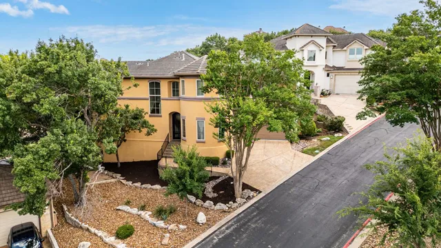 a view of a patio with a table and chairs next to a yard