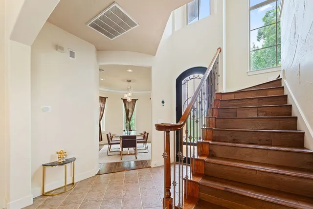 a view of entryway and hall with wooden floor