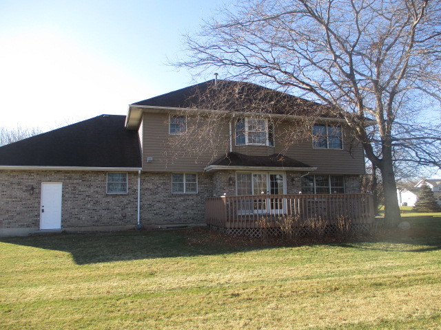 4818 5th Street Winthrop Harbor, IL 60096 - Photo 16 of 17 a front view of a house with a large tree