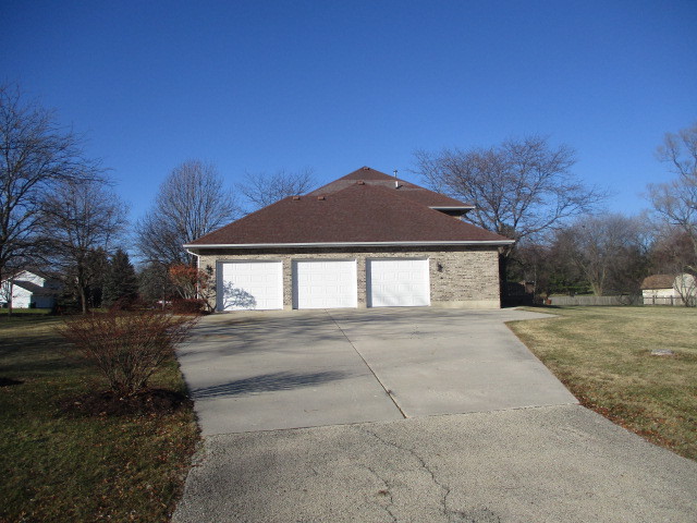 4818 5th Street Winthrop Harbor, IL 60096 - Photo 17 of 17 a front view of a house with a yard and garage